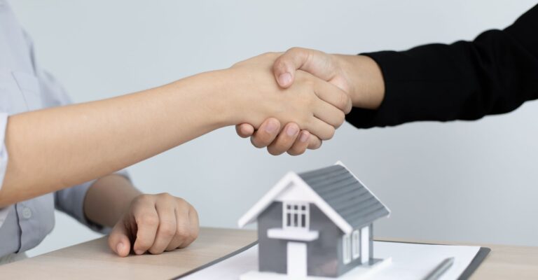 realtor shaking client's hand