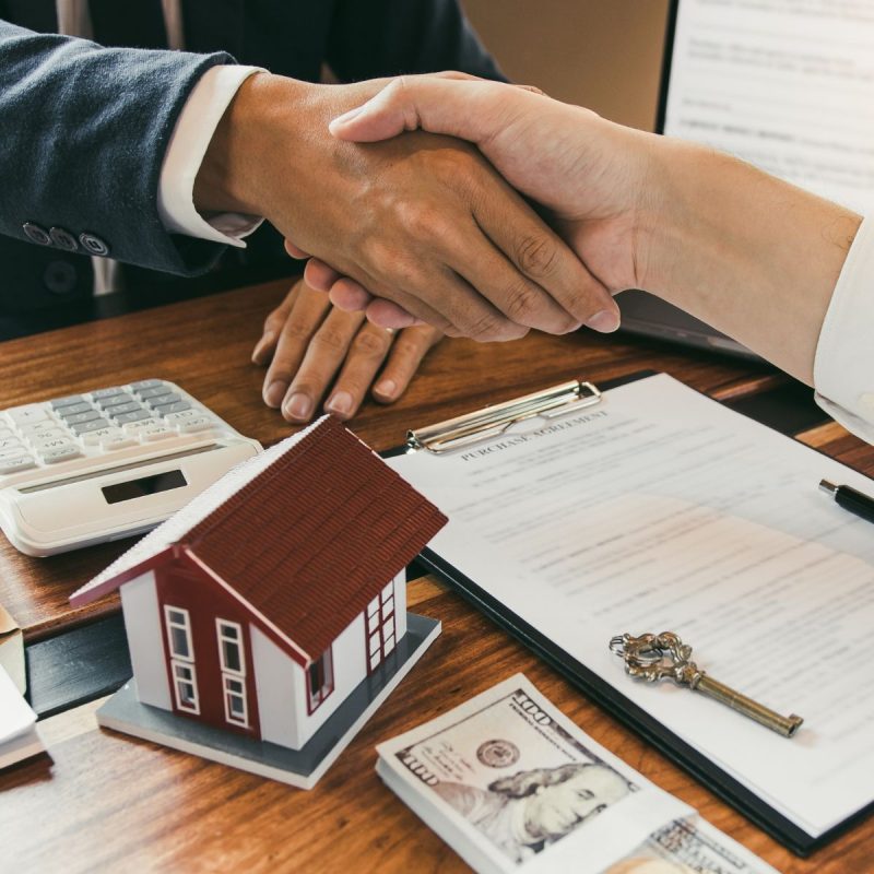 signing papers to sell a home
